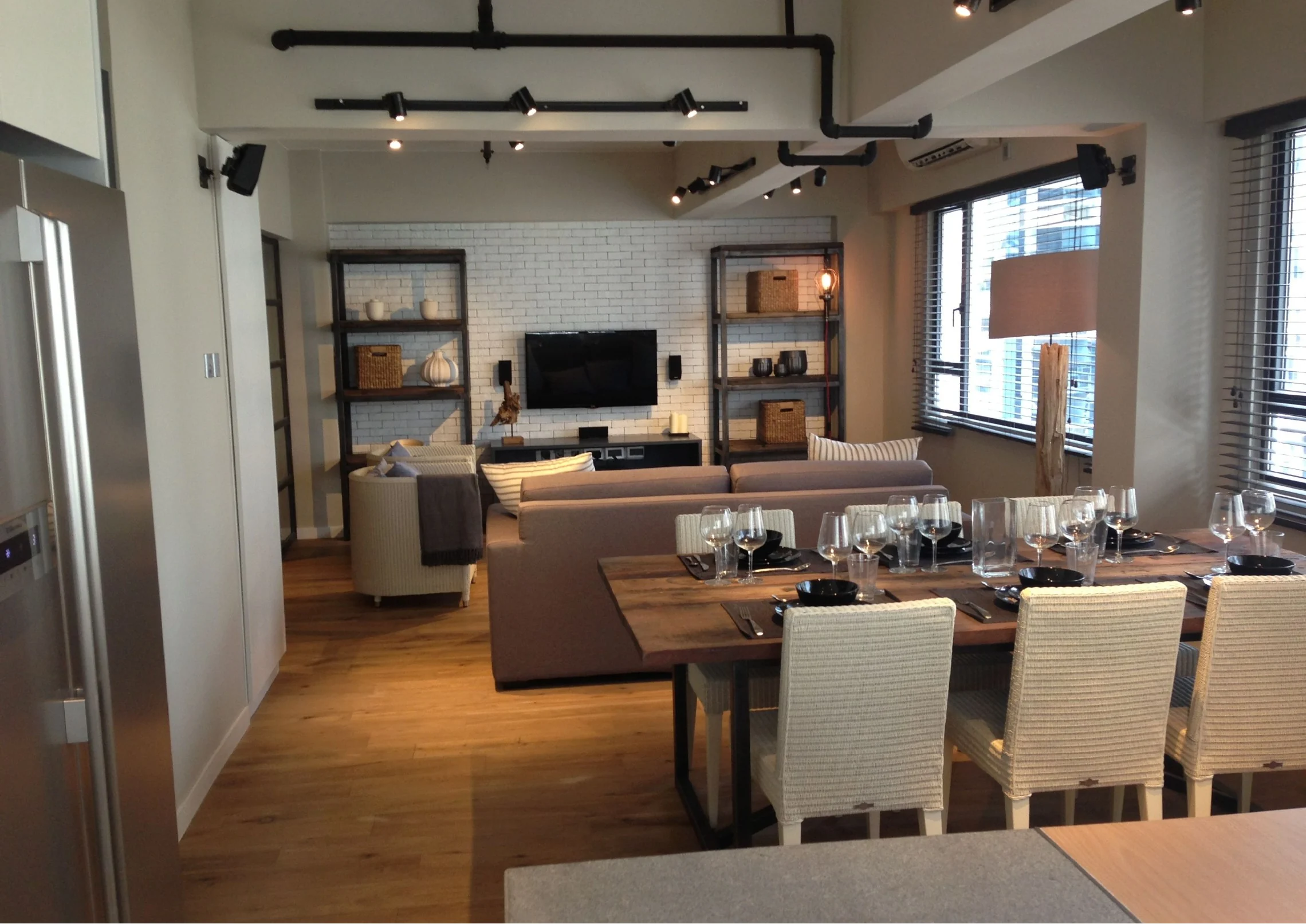 View connecting the dining table and living area in the Central home