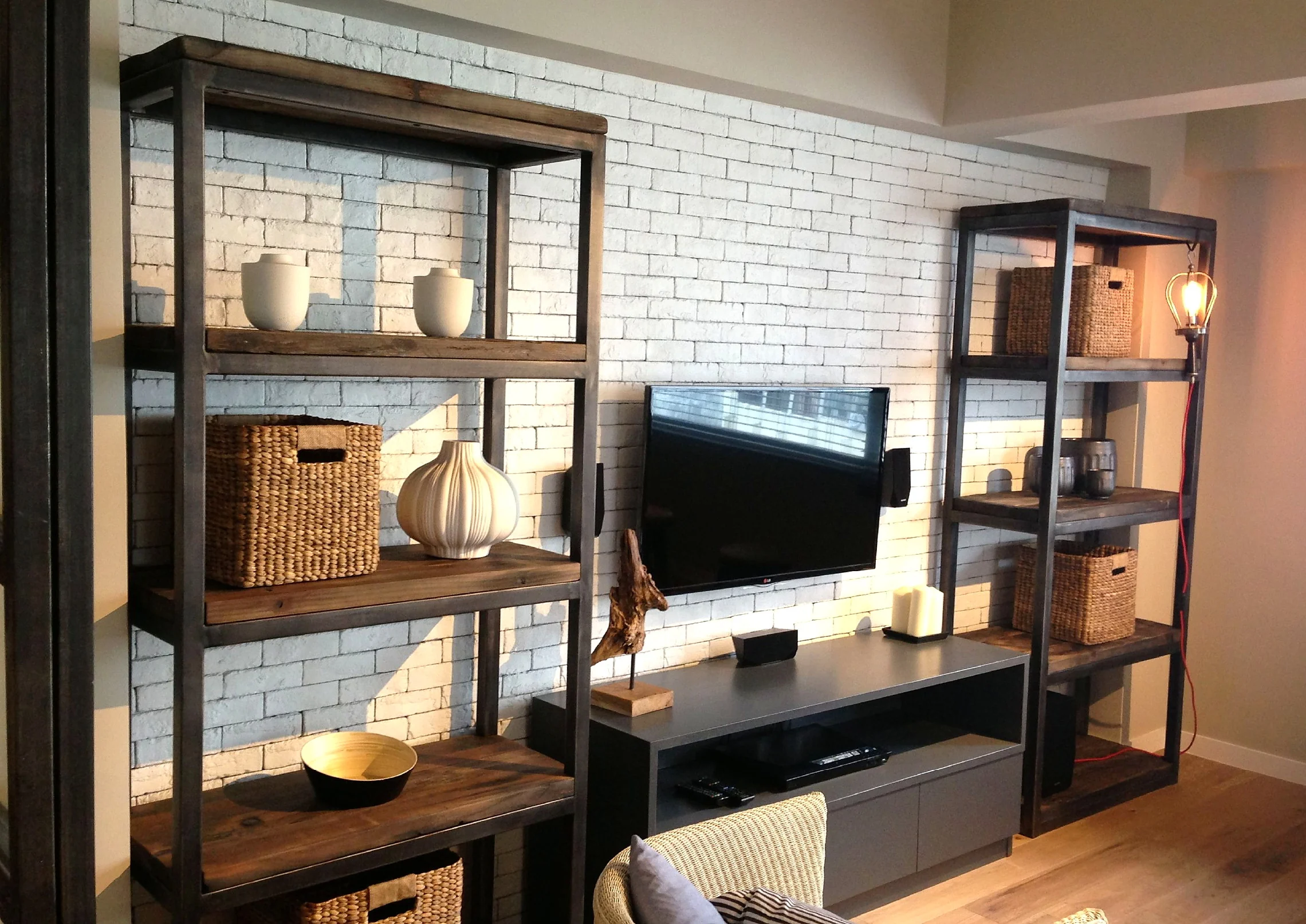 Warm timber shelving and a living area in a Central residential project
