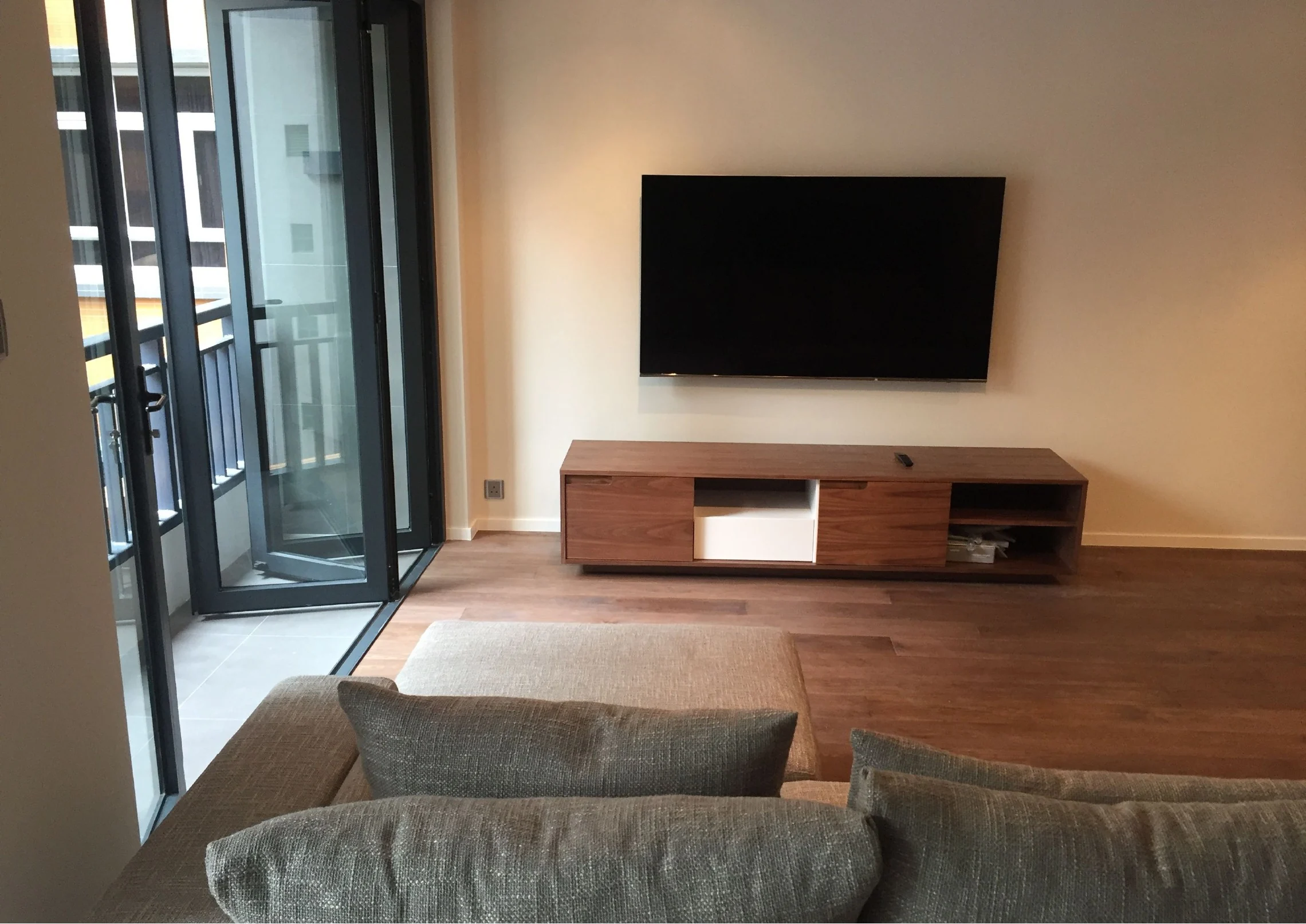 View over the seating toward the television and low media unit
